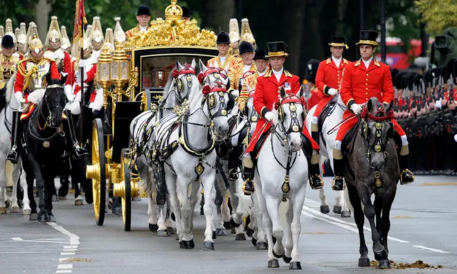 The Diamond Jubilee Coach being pulled by six Windsor Grey Horses during a royal procession