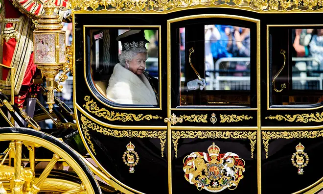 Queen Elizabeth in the Diamond Jubilee coach on it's debut for the State Opening of Parliament in 2014