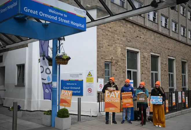 The intervention comes a day after the head of People hold placards on a picket line outside Great Ormond Street Children's Hospital in London declared a critical incident