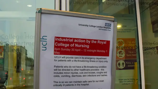 A display board outside a central London hospital warns patients of upcoming industrial action