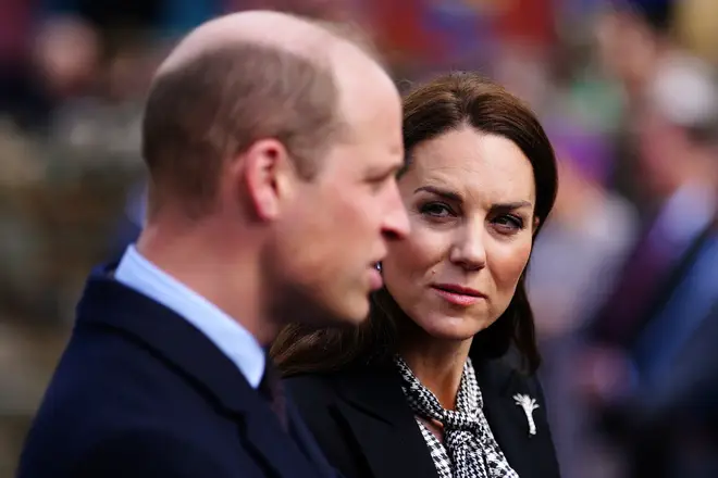 Prince William (L) and Princess Kate (R) during a visit the Aberfan memorial garden in Aberfan, south Wales on April 28, 2023, to pay their respects to those who lost their lives during the Aberfan disaster on October 21, 1966.