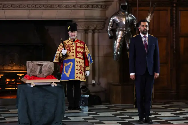 Humza Yousaf stands by the Stone of Destiny during a special ceremony at Edinburgh Castle on April 27, 2023 before it is transported to Westminster Abbey for the Coronation.