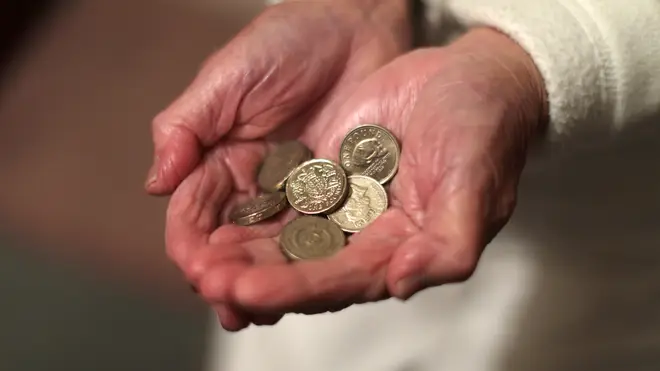 A woman holding coins
