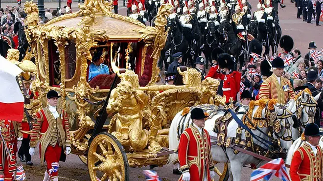 Queen Elizabeth' travelling in her golden state coach through London