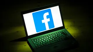 The Facebook logo on a laptop