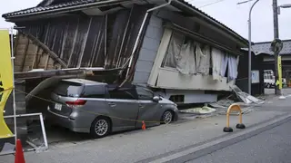 A car crushed under a house