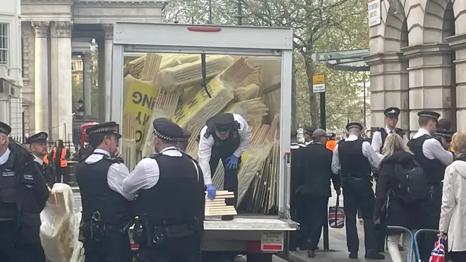 Officers were seen confiscating signs reading 'Not My King'