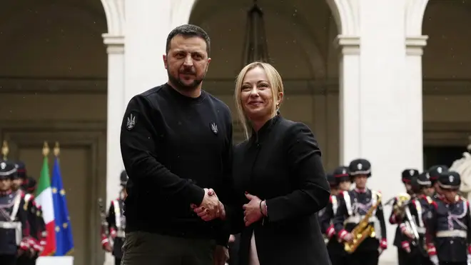 Italian Premier Giorgia Meloni, right, and Ukrainian President Volodymyr Zelensky shake hands before their meeting at Chigi Palace in Rome