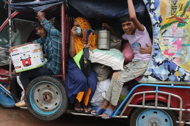 Bangladeshi people move to took shelter in the Cyclone Shelter during the storm