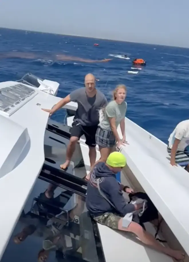 Footage showed passengers stood on the side of the ship after it took on water