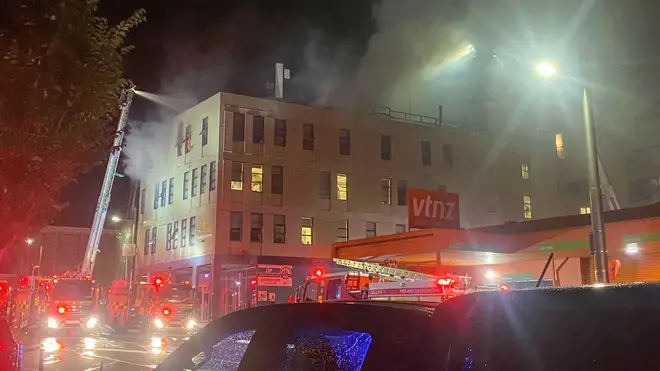 Firefighters battle a fire at the site where a fire broke out in downtown Wellington