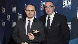 Directors Andrey Zvyagintsev and Alexander Rodnyansky, right, pose for photographers after receiving the Official Competition Best Film award for their film Loveless at the London Film Festival Awards