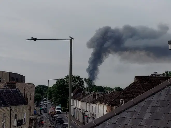 Emergency services could be seen tackling the blaze, with residents warned to keep doors and windows shut after smoke filled the air.