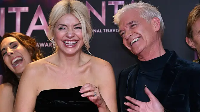 Holly Willoughby and Phillip Schofield laughing at the NTA awards after winning an award for This Morning