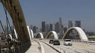 Cars drive along the 6th Street Viaduct in Los Angeles