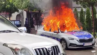 A police car burns in Zvecan, northern Kosovo
