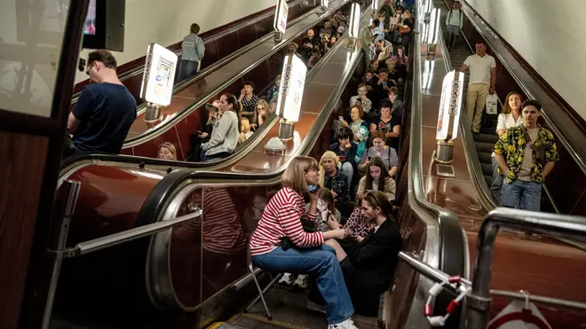People take cover at metro station during a Russian rocket attack in Kyiv,