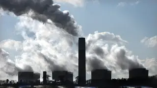 Smoke rising out of chimneys at a power station