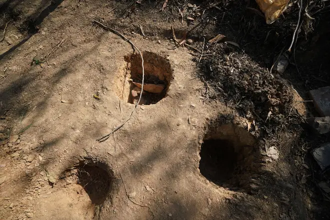 Several holes were dug and items were recovered but it is unclear what exactly was found