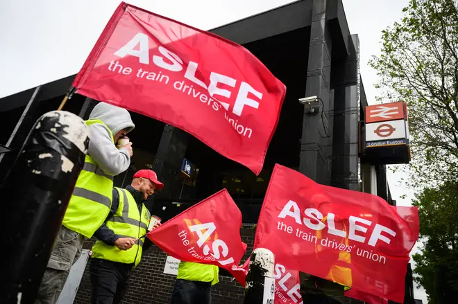 Rail workers stand on a picket line outside Euston rail station as the new round of strikes by train drivers begins on May 31, 2023 in London, England.
