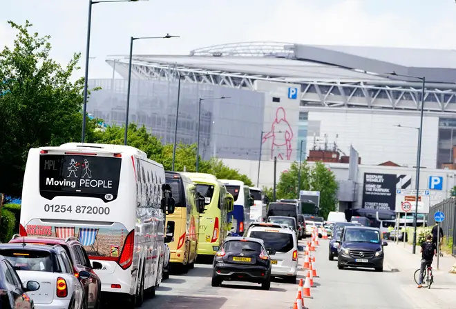 Coaches carrying fans make their way towards Wembley Stadium ahead of the FA Cup final