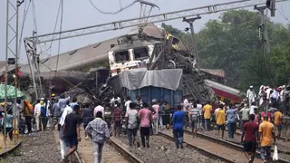 Rescuers work at the site of passenger trains that derailed in Balasore district, in the eastern Indian state of Orissa, Saturday, June 3, 2023. Rescuers are wading through piles of debris and wreckag