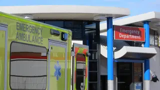 Ambulance vehicle parked outside of hospital emergency department