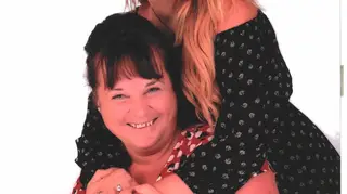 Michelle Hodgkinson poses for a picture with her daughter