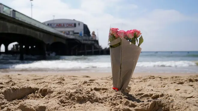 A bunch of flowers left on Bournemouth beach for the 17-year-old-boy and a girl aged 12 who sustained "critical injuries"