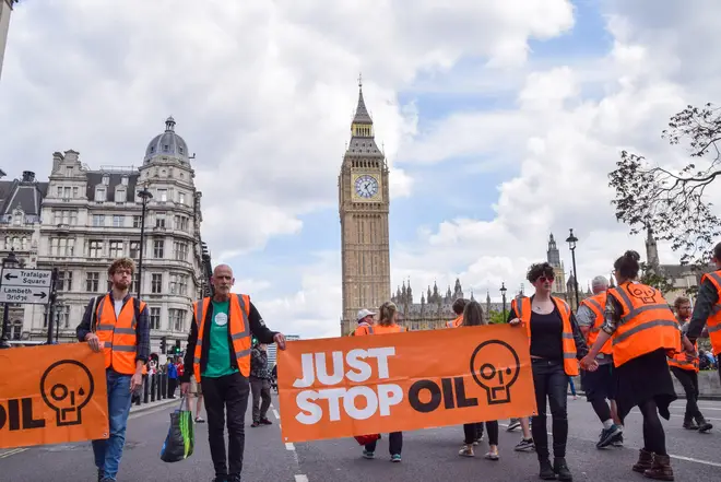 Just Stop Oil activists passing through Parliament Square, in their daily slow march demanding that the government stops issuing new fossil fuel licences
