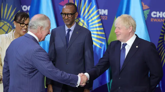 Charles shakes hands with Boris Johnson as they attend the Commonwealth Heads of Government Meeting (CHOGM) opening ceremony at Kigali Convention Centre, Rwanda.