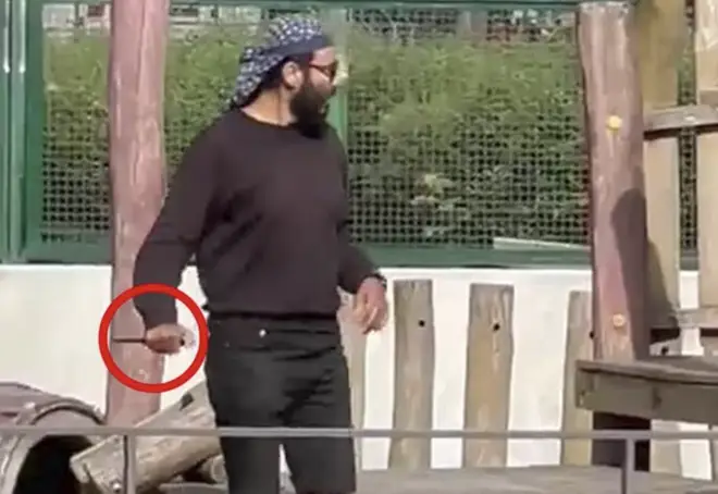The attacker is seen in footage calmly walking through the children's play area