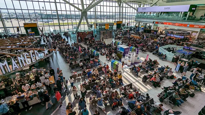 London Heathrow airport terminal packed with people