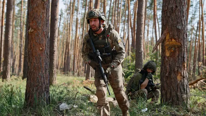 Ukrainian soldiers works during a combat operation on the frontline near Kreminna, Luhansk region