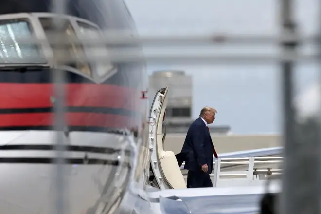 Republican presidential candidate former U.S. President Donald Trump arrives at the Miami International Airport