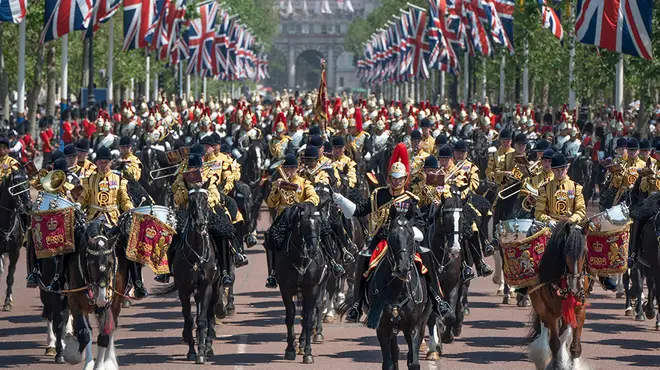 Trooping the Colour in June 2022 with hundred of black horses parading down The Mall