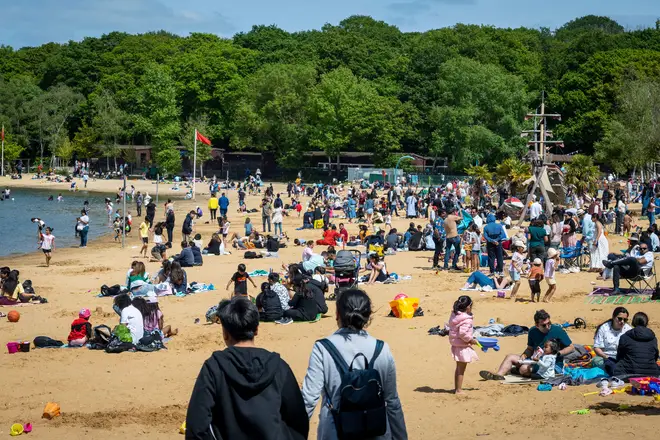 People enjoy the May Bank Holiday Monday sunshine and 17C temperatures at Ruislip Lido in north west London