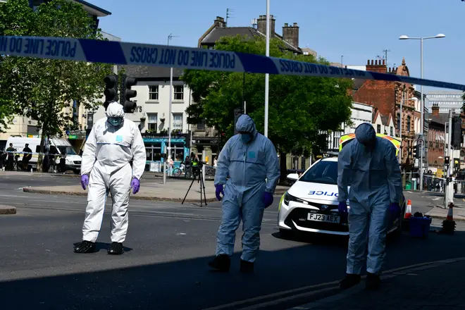 Forensics officers search for evidence after the attacks in Nottingham
