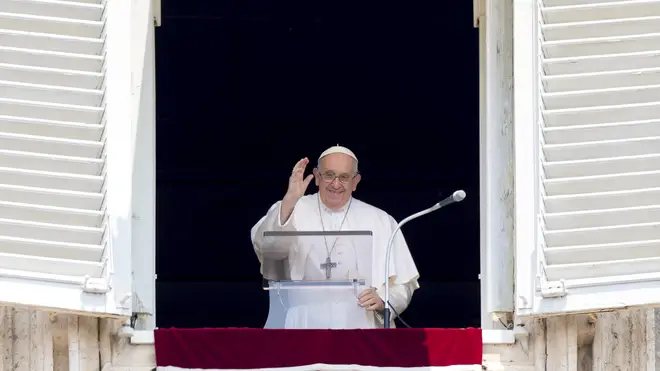 Pope Francis delivers a blessing from a window overlooking St Peter’s Square at the Vatican