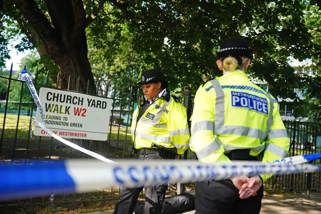 Police officers at the scene on Church Yard Walk near to Paddington Green in London, after a boy was stabbed to death