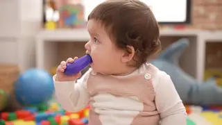 A child sucking on a toy