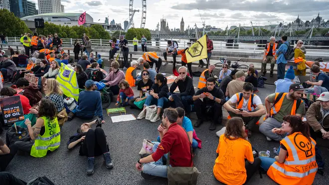 Just Stop Oil protesters stage a sit-in on Waterloo Bridge