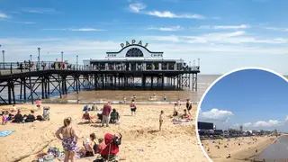 Beachgoers relax by the beach at Cleethorpes, Lincs