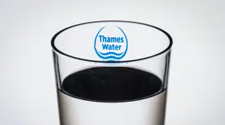 A glass of water with the Thames Water logo