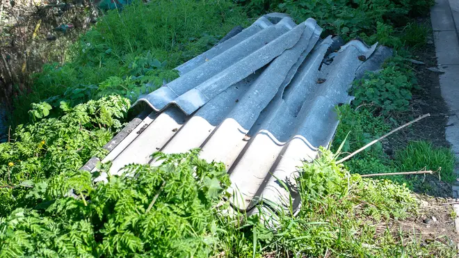 Sheets of asbestos are dumped at a site in the West Midlands