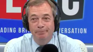 Nigel Farage looked amused during the call