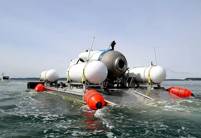 The sub, pictured here on its launch craft before a descent, is facing multiple claims of safety failings.