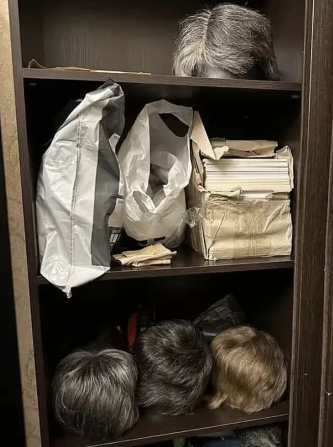 A variety of wigs in a cupboard at the palace