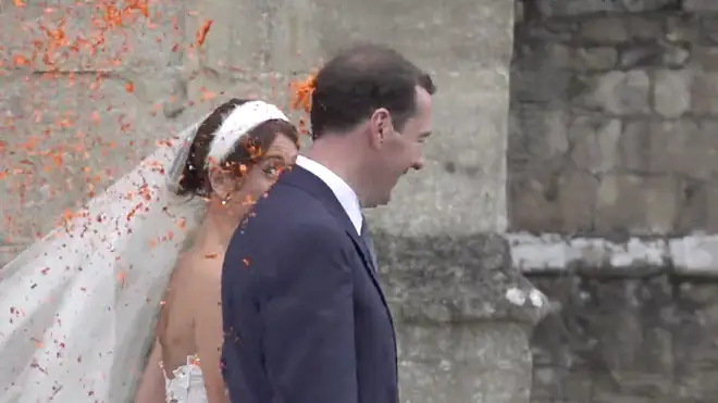 The happy couple walked on as the confetti was poured onto their back and shoulders