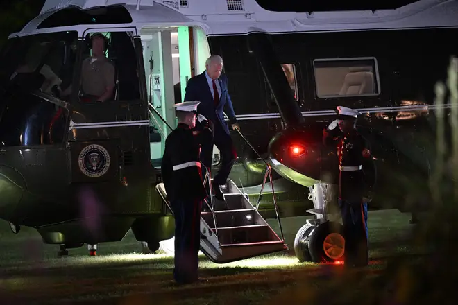 US President Joe Biden disembarks Marine One at Winfield House Landing Zone in London on July 9, 2023